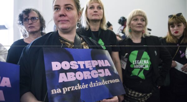April 11, 2024, Warsaw, Poland: An activist of the Women's Strike (Strajk Kobiet) organisation holds a placard that reads Access to abortion at a press conference in the Parliamentary hall. Poland's parliament holds a long-awaited debate on liberalization of the country's strict abortion law. The traditionally Catholic nation has one of the most restrictive laws in Europe but the reality is that many women terminate pregnancies at home with pills mailed from abroad. Lawmakers in the lower house (Sejm) of parliament will consider four different proposals on 11th and 12th April during the 9th session of the Parliament. Currently abortion is regulated by a 1993 law, which was heavily influenced by the Catholic church, and further restricted following a 2020 constitutional court ruling preventing abortion in case of fetal abnormalities. Marta Lempart, the leader of the Women's Strike organization (Strajk Kobiet), also appeared in the Sejm, along with pro-abortion activists who were not allowed into the session room. During the debate on the liberalization of abortion in the Sejm, outside the parliament, Kaja Godek - the ultra-right-wing and Catholic leader of the pro-life Ordo Iuris association - protested against the liberalization of abortion bill and, together with pro-life activists, put up obscene banners with fetal bodies in the street.,Image: 864097944, License: Rights-managed, Restrictions: , Model Release: no, Credit line: Attila Husejnow / Zuma Press / Profimedia