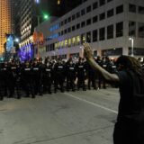 (150524) -- CLEVELAND, May 24, 2015 () -- A protester holds up his hands before police in Cleveland, Ohio, the United States, May 23, 2015. Shortly after a white police officer in the U.S. state of Ohio was found not guilty in the killing of an unarmed black man and woman after a 22-mile car chase in November 2012, U.S. Justice Department announced that it would review the case.,Image: 246289634, License: Rights-managed, Restrictions: , Model Release: no, Credit line: Bao Dandan / Avalon / Profimedia