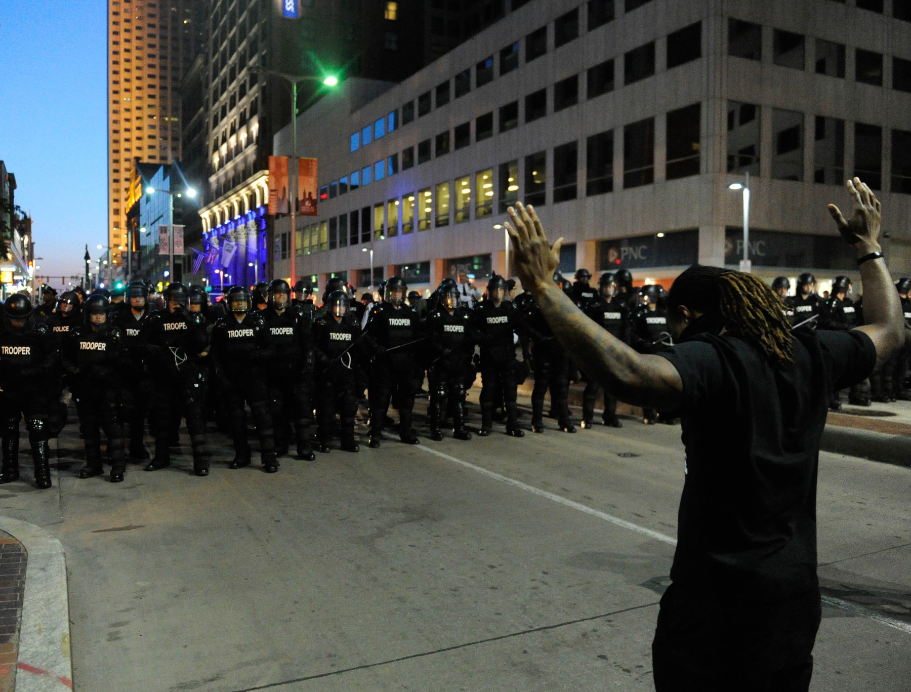 (150524) -- CLEVELAND, May 24, 2015 () -- A protester holds up his hands before police in Cleveland, Ohio, the United States, May 23, 2015. Shortly after a white police officer in the U.S. state of Ohio was found not guilty in the killing of an unarmed black man and woman after a 22-mile car chase in November 2012, U.S. Justice Department announced that it would review the case.,Image: 246289634, License: Rights-managed, Restrictions: , Model Release: no, Credit line: Bao Dandan / Avalon / Profimedia