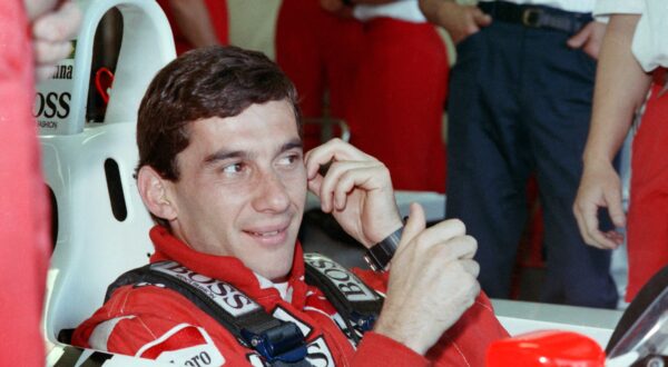 New world champion Ayrton Senna of Brazil smiles to his staff members in the pit during the final qualifying for the Australian F1 Grand Prix in Adelaide on November 12, 1988.,Image: 425803642, License: Rights-managed, Restrictions: , Model Release: no, Credit line: AFP / AFP / Profimedia