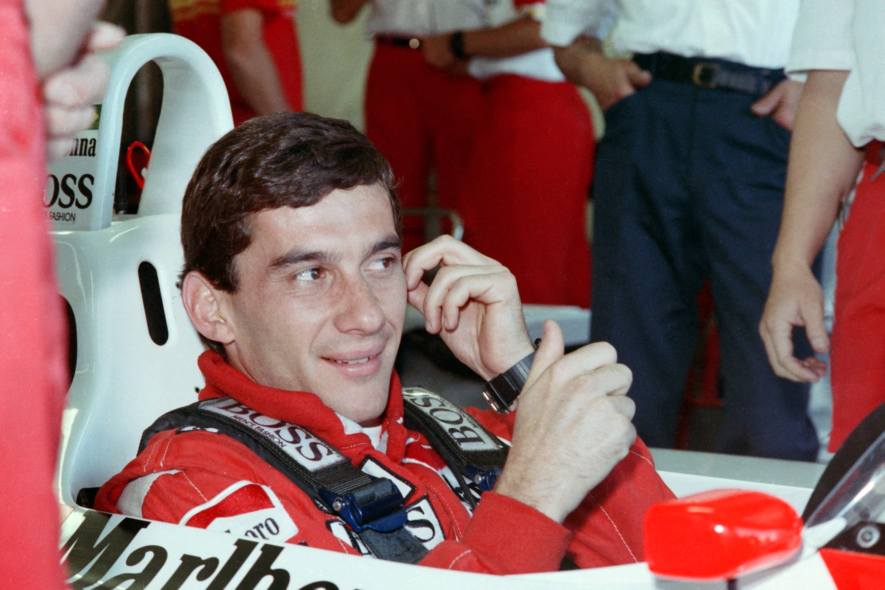 New world champion Ayrton Senna of Brazil smiles to his staff members in the pit during the final qualifying for the Australian F1 Grand Prix in Adelaide on November 12, 1988.,Image: 425803642, License: Rights-managed, Restrictions: , Model Release: no, Credit line: AFP / AFP / Profimedia