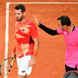 US Austin Krajicek (L) and Croatia's Ivan Dodig greet each others after a point during their men's doubles final match on day fourteen of the Roland-Garros Open tennis tournament at the Court Philippe-Chatrier in Paris on June 10, 2023.,Image: 782625970, License: Rights-managed, Restrictions: , Model Release: no, Credit line: Emmanuel DUNAND / AFP / Profimedia