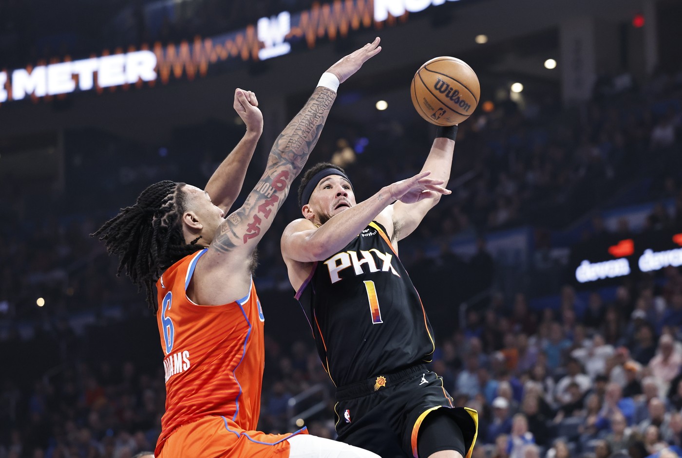 Mar 29, 2024; Oklahoma City, Oklahoma, USA; Phoenix Suns guard Devin Booker (1) goes up for a basket as Oklahoma City Thunder forward Jaylin Williams (6) defends during the first half at Paycom Center.,Image: 861021453, License: Rights-managed, Restrictions: , Model Release: no, Credit line: USA TODAY Sports / ddp USA / Profimedia