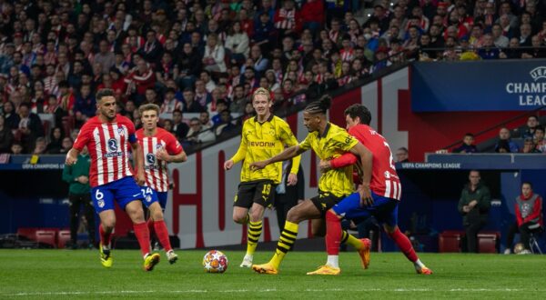 April 10, 2024, Madrid, Spain: Sébastien Haller (C), Borussia Dotmund player, defends a ball under pressure from Stefan Savi? (2) and the gaze of Julian Brandt (19), Borussia player, and Koke (6) and Rodrigo Riquelme, (24), Atlético players of Madrid during the first leg of the quarterfinals of the UEFA Champions League played at the Metropolitano stadium in Madrid. First leg match for the quarterfinals of the UEFA Champions League played at the Metropolitan Stadium in Madrid between Atlético de Madrid and the German Borusia Dormund with a score of 2 goals to 1 for the local team with goals from Rodrigo de Paul (4' ) and Samuel Lino (32') for the ATM and Sebastian Haller (81') for the visitors.,Image: 864050000, License: Rights-managed, Restrictions: , Model Release: no, Credit line: David Canales / Zuma Press / Profimedia