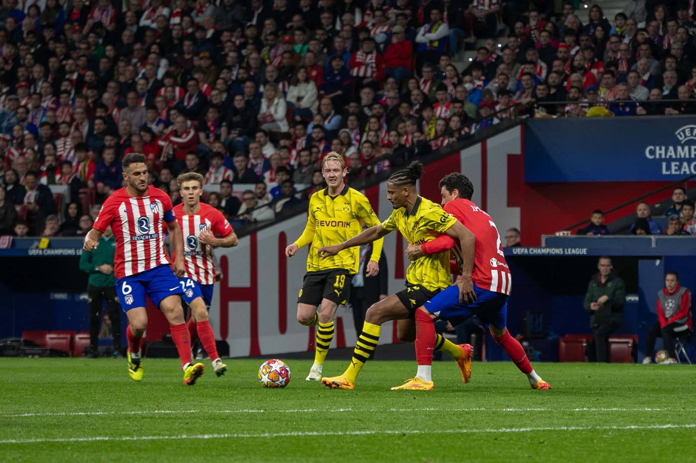April 10, 2024, Madrid, Spain: Sébastien Haller (C), Borussia Dotmund player, defends a ball under pressure from Stefan Savi? (2) and the gaze of Julian Brandt (19), Borussia player, and Koke (6) and Rodrigo Riquelme, (24), Atlético players of Madrid during the first leg of the quarterfinals of the UEFA Champions League played at the Metropolitano stadium in Madrid. First leg match for the quarterfinals of the UEFA Champions League played at the Metropolitan Stadium in Madrid between Atlético de Madrid and the German Borusia Dormund with a score of 2 goals to 1 for the local team with goals from Rodrigo de Paul (4' ) and Samuel Lino (32') for the ATM and Sebastian Haller (81') for the visitors.,Image: 864050000, License: Rights-managed, Restrictions: , Model Release: no, Credit line: David Canales / Zuma Press / Profimedia