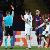 Romanian referee Istvan Kovacs gives a red card to Barcelona's Uruguayan defender #04 Ronald Araujo during the UEFA Champions League quarter-final second leg football match between FC Barcelona and Paris SG at the Estadi Olimpic Lluis Companys in Barcelona on April 16, 2024.,Image: 865395091, License: Rights-managed, Restrictions: , Model Release: no, Credit line: FRANCK FIFE / AFP / Profimedia