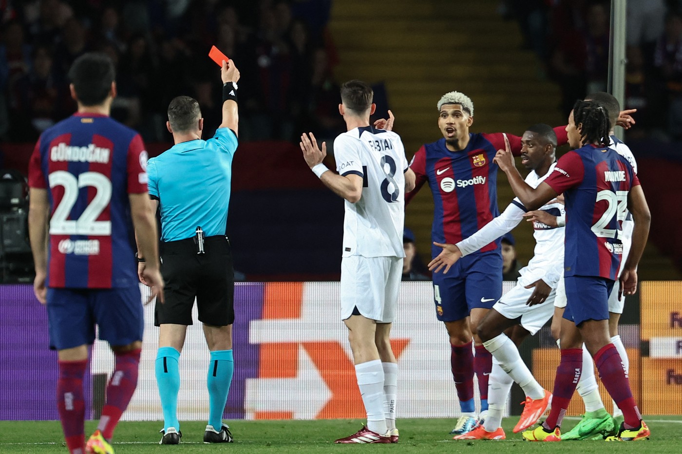 Romanian referee Istvan Kovacs gives a red card to Barcelona's Uruguayan defender #04 Ronald Araujo during the UEFA Champions League quarter-final second leg football match between FC Barcelona and Paris SG at the Estadi Olimpic Lluis Companys in Barcelona on April 16, 2024.,Image: 865395091, License: Rights-managed, Restrictions: , Model Release: no, Credit line: FRANCK FIFE / AFP / Profimedia