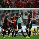 Bayer Leverkusen's French forward #21 Amine Adli (C) celebrates scoring the 1-2 goal with his team-mates during the German first division Bundesliga football match Bayer 04 Leverkusen v VfL Stuttgart in Leverkusen, western Germany, on April 27, 2024.,Image: 868427066, License: Rights-managed, Restrictions: DFL REGULATIONS PROHIBIT ANY USE OF PHOTOGRAPHS AS IMAGE SEQUENCES AND/OR QUASI-VIDEO, Model Release: no, Credit line: INA FASSBENDER / AFP / Profimedia