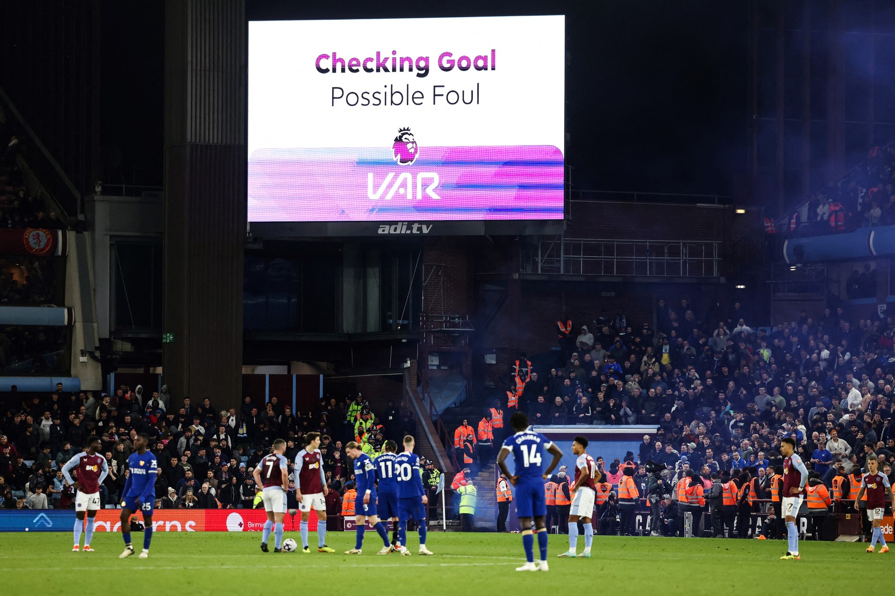 Players wait for referee Craig Pawson to check the VAR before disallowing the goal of Chelsea's French defender #02 Axel Disasi due to an offside position during the English Premier League football match between Aston Villa and Chelsea at Villa Park in Birmingham, central England on April 27, 2024.,Image: 868462195, License: Rights-managed, Restrictions: RESTRICTED TO EDITORIAL USE. No use with unauthorized audio, video, data, fixture lists, club/league logos or 'live' services. Online in-match use limited to 120 images. An additional 40 images may be used in extra time. No video emulation. Social media in-match use limited to 120 images. An additional 40 images may be used in extra time. No use in betting publications, games or single club/league/player publications., Model Release: no, Credit line: Darren Staples / AFP / Profimedia