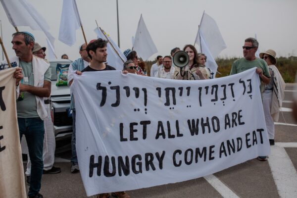 Activists hold a sign during a protest near the Gaza strip border in Israel on Friday, April 26, 2024. Rabbis belonging to the U.S.-based organization 