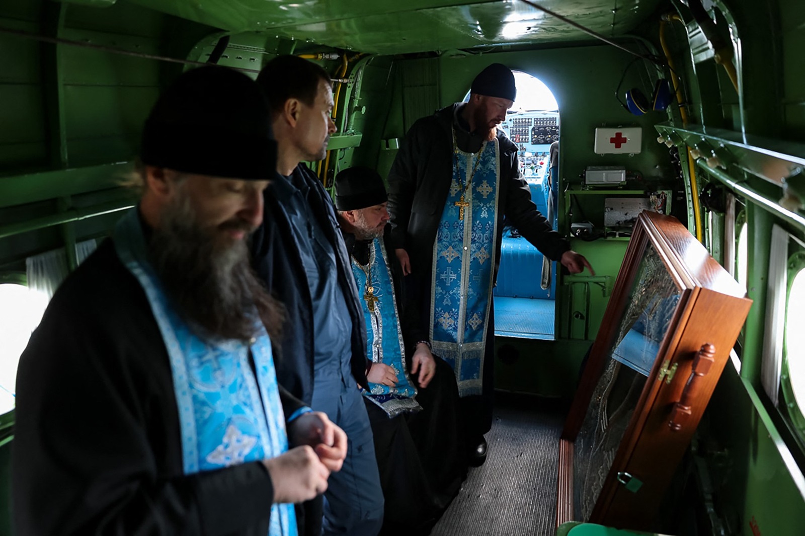 In this handout picture released by the Kurgan region branch of the Russian Orthodox Church on April 11, 2024 Orthodox priests conduct a service with a miraculous icon of the Mother of God aboard an Antonov An-2 plane during an aerial monitoring flight with emergencies specialists over the Kurgan region as part of anti-flood measures.,Image: 864219048, License: Rights-managed, Restrictions: RESTRICTED TO EDITORIAL USE - MANDATORY CREDIT "AFP PHOTO / Kurgan region branch of the Russian Orthodox Church" - NO MARKETING NO ADVERTISING CAMPAIGNS - DISTRIBUTED AS A SERVICE TO CLIENTS, ***
HANDOUT image or SOCIAL MEDIA IMAGE or FILMSTILL for EDITORIAL USE ONLY! * Please note: Fees charged by Profimedia are for the Profimedia's services only, and do not, nor are they intended to, convey to the user any ownership of Copyright or License in the material. Profimedia does not claim any ownership including but not limited to Copyright or License in the attached material. By publishing this material you (the user) expressly agree to indemnify and to hold Profimedia and its directors, shareholders and employees harmless from any loss, claims, damages, demands, expenses (including legal fees), or any causes of action or allegation against Profimedia arising out of or connected in any way with publication of the material. Profimedia does not claim any copyright or license in the attached materials. Any downloading fees charged by Profimedia are for Profimedia's services only. * Handling Fee Only 
***, Model Release: no, Credit line: Handout / AFP / Profimedia
