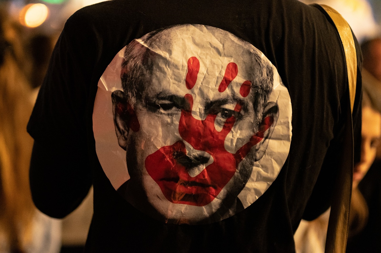 April 6, 2024, Tel Aviv, Tel Aviv, Israel: T-Shirt with face of Netanyahu with bloody hand on his face. Thousands of Israeli antigovernment protesters have gathered in Tel Aviv, among other parts of the country, to call on the government to reach a deal to free dozens of captives held by the Hamas group in Gaza and to hold early elections.,Image: 863022087, License: Rights-managed, Restrictions: , Model Release: no, Credit line: Gaby Schutze / Zuma Press / Profimedia