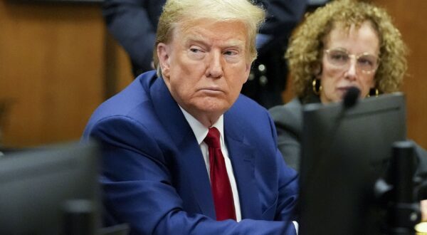epa11242882 Former US President Donald Trump (L) with his lawyer Susan Necheles (R) awaits the start of a pre-trial hearing with his defense team in Manhattan criminal court in New York City, New York, USA, 25 March 2024. A judge will weigh when the former president will go on trial. Trump is facing 34 felony counts of falsifying business records related to payments made to adult film star Stormy Daniels during his 2016 presidential campaign.  EPA/MARY ALTAFFER / POOL