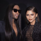 Law Roach and Zendaya pose for a photographer upon arrival at the Valentino ready-to-wear Spring/Summer 2023 fashion collection presented Sunday, Oct. 2, 2022 in Paris. (Photo by Vianney Le Caer/Invision/AP)