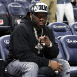 50 Cent poses for a photo prior to an NBA basketball game between the Washington Wizards and the Minnesota Timberwolves, Tuesday, April 9, 2024, in Minneapolis. (AP Photo/Matt Krohn)