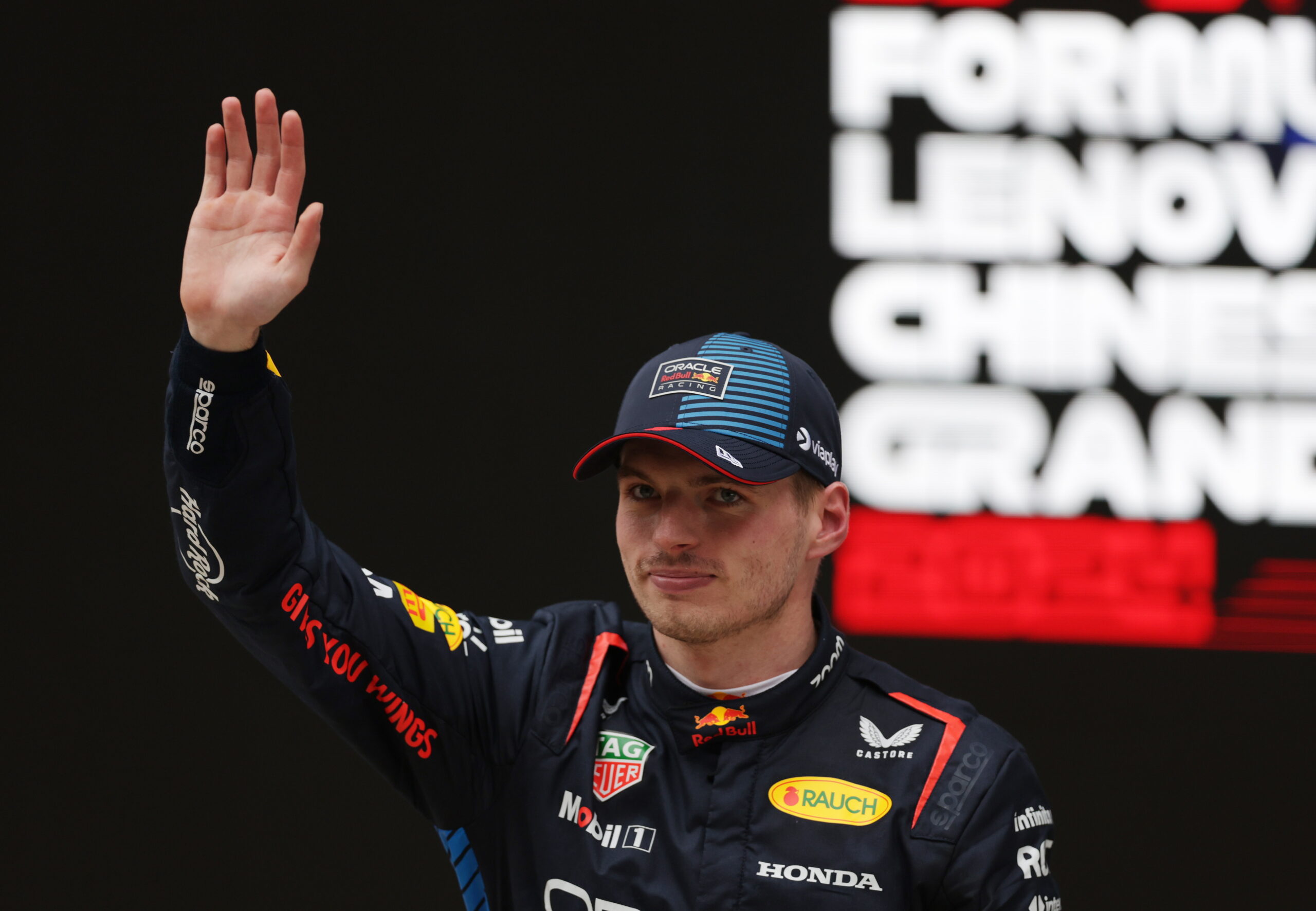 epa11291202 Red Bull Racing driver Max Verstappen of the Netherlands waves after winning the Formula One Chinese Grand Prix, in Shanghai, China, 21 April 2024. The 2024 Formula 1 Chinese Grand Prix is held at the Shanghai International Circuit racetrack on 21 April after a five-year hiatus.  EPA/ALEX PLAVEVSKI