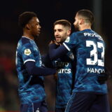 epa11301343 Luka Ivanusec of Feyenoord (C) celebrates scoring the 0-2 goal with his teammates Antoni Milambo (L) and David Hancko (R) during the Dutch Eredivisie match between Go Ahead Eagles and Feyenoord Rotterdam in Deventer, the Netherlands, 25 April 2024.  EPA/VINCENT JANNINK