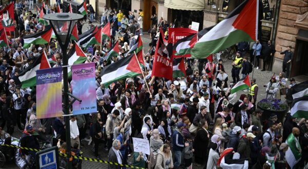 epa11329134 Demonstrators with Palestinian flags gather during the 'Stop Israel' demonstration between Stortorget and Molleplatsen in Malmo, Sweden, 09 May 2024. Organizers expect thousands to participant in the protest against Israel's participation in the 68th edition of the Eurovision Song Contest (ESC) at the Malmo Arena. The ESC comprises two semi-finals, held on 07 and 09 May, and a grand final on 11 May 2024.  EPA/JOHAN NILSSON SWEDEN OUT