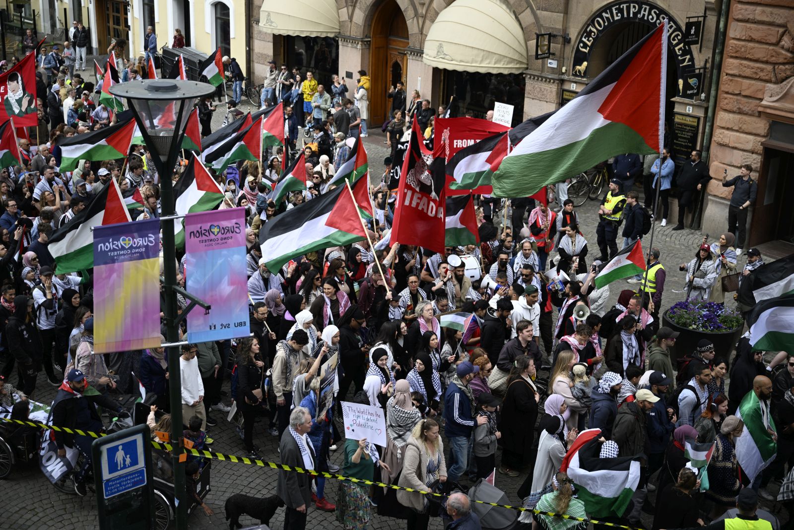 epa11329134 Demonstrators with Palestinian flags gather during the 'Stop Israel' demonstration between Stortorget and Molleplatsen in Malmo, Sweden, 09 May 2024. Organizers expect thousands to participant in the protest against Israel's participation in the 68th edition of the Eurovision Song Contest (ESC) at the Malmo Arena. The ESC comprises two semi-finals, held on 07 and 09 May, and a grand final on 11 May 2024.  EPA/JOHAN NILSSON SWEDEN OUT