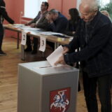 epa11335245 A man casts his vote in polling station during presidental elections in Vilnius, Lithuania, 12 May 2024. Lithuanians are voting in the presidential election, in which eight candidates are running for the post, including incumbent President Gitanas Nauseda. A second round will be held on 26 May if no candidate receives an absolute majority of votes in the first round.  EPA/VALDA KALNINA