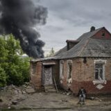 epa11348680 A local man sits near his damaged home as smoke rises after shelling, on the outskirts of Kharkiv, Ukraine, 17 May 2024, amid the Russian invasion. More than 9,000 residents from settlements in areas of the Kharkiv region bordering Russia have been evacuated as hostilities intensified, the head of the Kharkiv Military Administration Oleg Synegubov said on 17 May. The evacuations follow a cross-border offensive by Russian forces, who claimed the capture of several villages in the region. Russian troops entered Ukrainian territory on 24 February 2022, starting a conflict that has provoked destruction and a humanitarian crisis.  EPA/SERGEY KOZLOV