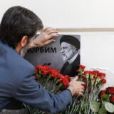epa11355321 A man places a portrait of the late Iranian President Ebrahim Raisi next to flowers laid outside the Iranian embassy, following the deaths of Iran's president Raisi and Foreign Minister Amir-Abdollahian, in Moscow, Russia, 20 May 2024. According to Iranian state media, President Raisi, Foreign Minister Hossein Amir-Abdollahian and several others were killed in a helicopter crash in the mountainous Varzaghan area on 19 May, during their return to Tehran, after an inauguration ceremony of the joint Iran-Azerbaijan constructed Qiz-Qalasi dam at the Aras river. Iran's first Vice President Mohammad Mokhber was appointed as the country's interim president following the death of Raisi, Iranian supreme leader Ayatollah Ali Khamenei announced in a condolence message on 20 May 2024.  EPA/YURI KOCHETKOV