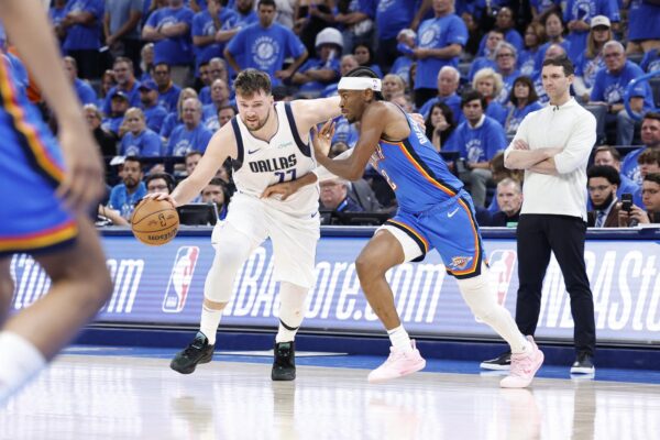 May 9, 2024; Oklahoma City, Oklahoma, USA; Dallas Mavericks guard Luka Doncic (77) moves past Oklahoma City Thunder guard Shai Gilgeous-Alexander (2) during the second half of game two of the second round for the 2024 NBA playoffs at Paycom Center. Mandatory Credit: Alonzo Adams-USA TODAY Sports Photo: Alonzo Adams/REUTERS