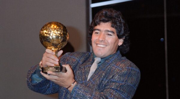Diego Maradona poses with the Ballon d'Or at the Lido in Paris on November 13, 1986. He was awarded following the 1986 FIFA World Cup. The Golden Ball award is presented to the best player at each FIFA World Cup finals.,Image: 800969633, License: Rights-managed, Restrictions: , Model Release: no, Credit line: Pascal GEORGE / AFP / Profimedia