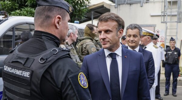 French President Emmanuel Macron visits the central police station with France's Minister for Interior and Overseas Gerald Darmanin (R) in Noumea, France's Pacific territory of New Caledonia on May 23, 2024. France's president made a long-haul trip to the restive Pacific territory of New Caledonia on on May 23, urging a "return to peace" after deadly rioting, and vowing thousands of military reinforcements will be deployed for "as long as necessary".,Image: 875675314, License: Rights-managed, Restrictions: , Model Release: no, Credit line: Ludovic MARIN / AFP / Profimedia