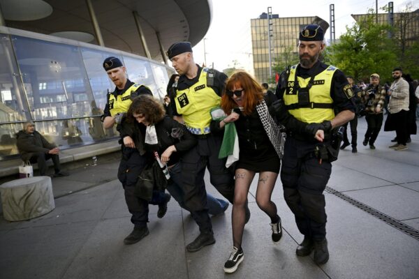 Police carrying away Pro-Palestinian protesters opposing Israel's participation in the 68th edition of the Eurovision Song Contest ESC demonstrate near the Malmö Arena, Sweden, on the eve of the Grand Final on May 11, 2024.,Image: 872048522, License: Rights-managed, Restrictions: FINLAND OUT. NO THIRD PARTY SALES., Model Release: no, Credit line: Antti Aimo-Koivisto / Lehtikuva / Profimedia