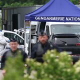 A forensic is at work as police officers patrol at the site of a ramming attack which took place late morning at a road toll in Incarville in the Eure region of northern France, on May 14, 2024. Two French prison officers were killed and two others wounded on May 14 in an attack on a prison van transporting an inmate who escaped, a police source told AFP.,Image: 872872981, License: Rights-managed, Restrictions: , Model Release: no, Credit line: ALAIN JOCARD / AFP / Profimedia