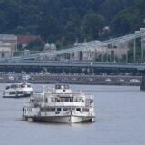 Sightseeing cruises are seen on the Danube river on May 30, 2019 in Budapest during the operations to pull out of the water the 