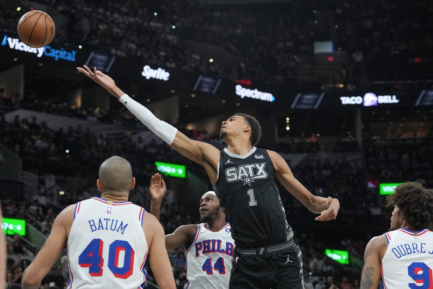 Apr 7, 2024; San Antonio, Texas, USA;  San Antonio Spurs center Victor Wembanyama (1) shoots in between Philadelphia 76ers forwards Nicolas Batum (40) and Paul Reed (44) in the first half at Frost Bank Center.,Image: 863205728, License: Rights-managed, Restrictions: , Model Release: no, Credit line: USA TODAY Sports / ddp USA / Profimedia