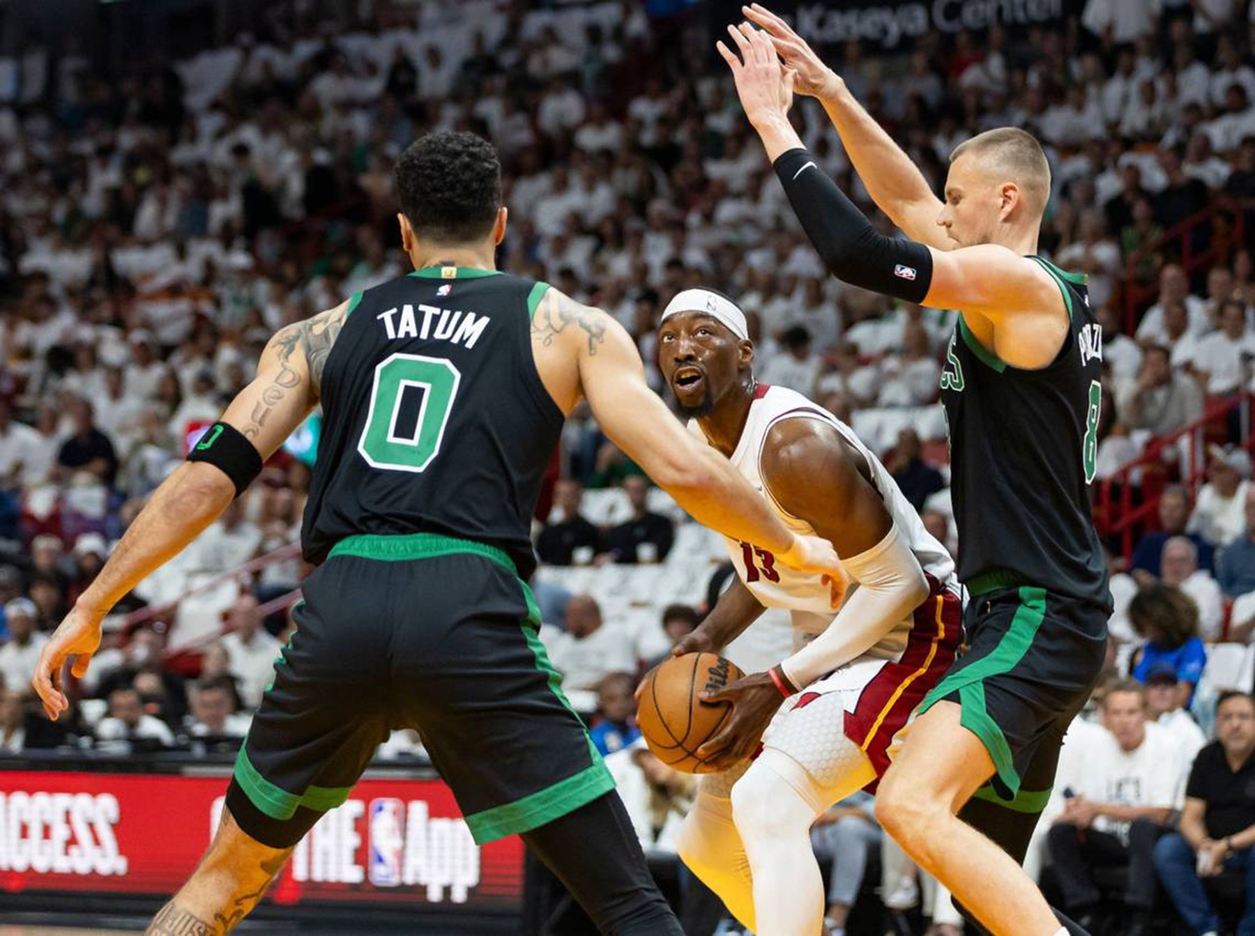 April 29, 2024: Miami Heat center Bam Adebayo (13) tries to score as Boston Celtics center Kristaps Porzingis (8) and forward Jayson Tatum (0) defend in the first half of Game 4 of an NBA basketball first-round playoff series at the Kaseya Center on Monday, April 29, 2024, in Miami.,Image: 869030540, License: Rights-managed, Restrictions: , Model Release: no, Credit line: Matias J. Ocner / Zuma Press / Profimedia