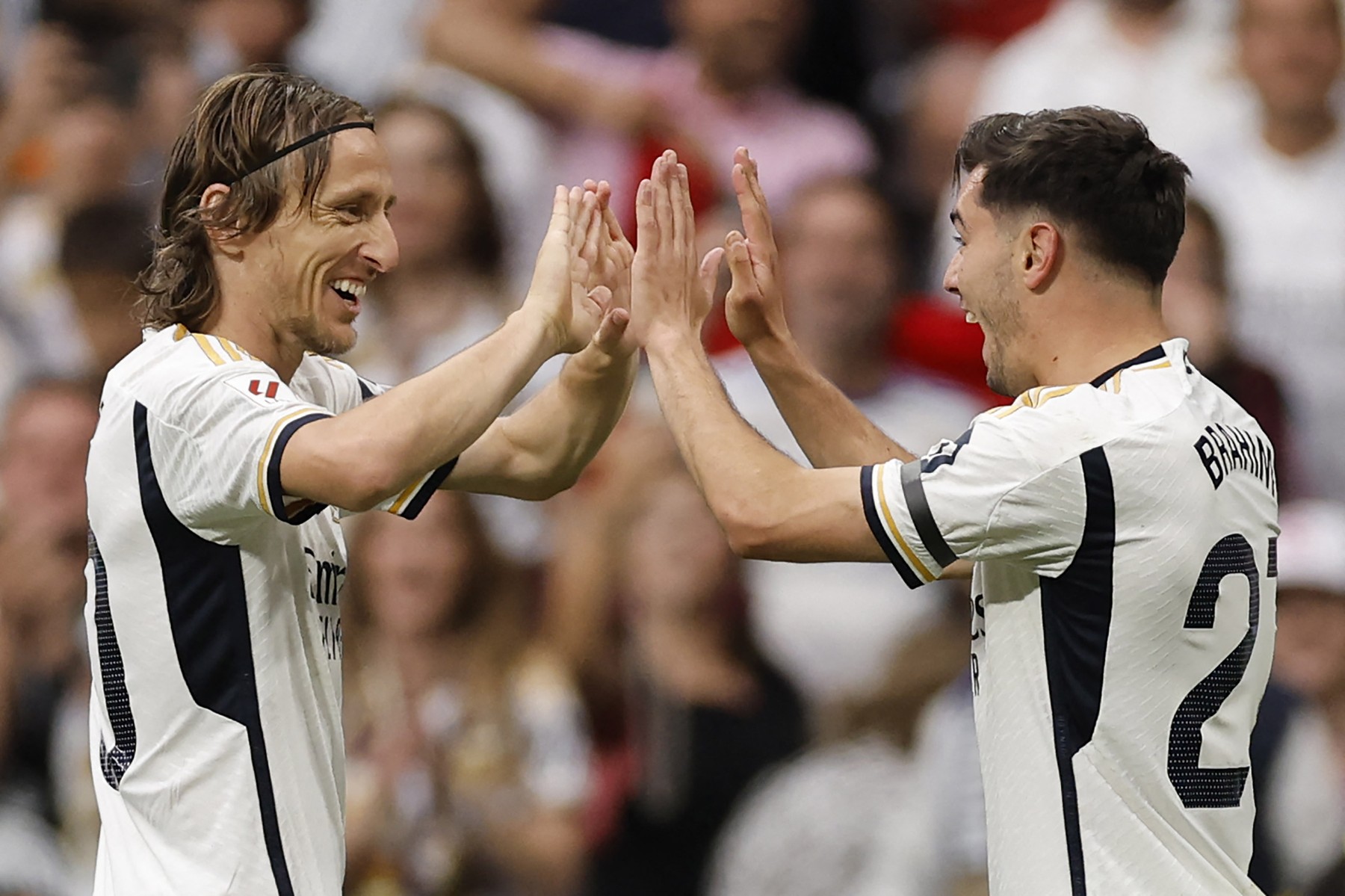 Real Madrid's Spanish forward #21 Brahim Diaz (R) celebrates scoring the opening goal, with Real Madrid's Croatian midfielder #10 Luka Modric, during the Spanish league football match between Real Madrid CF and Cadiz CF at the Santiago Bernabeu stadium in Madrid on May 4, 2024.,Image: 870189243, License: Rights-managed, Restrictions: , Model Release: no, Credit line: OSCAR DEL POZO / AFP / Profimedia