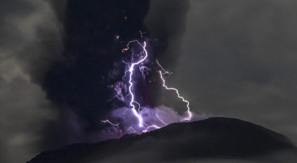 This handout picture taken and released on May 18, 2024 by the Indonesian Geological Agency shows Mount Ibu spewing volcanic ash as lightning strikes, as seen from the monitoring post in West Halmahera, North Maluku.,Image: 874128154, License: Rights-managed, Restrictions: RESTRICTED TO EDITORIAL USE - MANDATORY CREDIT 