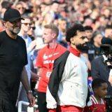 Liverpool's German manager Jurgen Klopp (L) walks out with Liverpool's Egyptian striker #11 Mohamed Salah (C) ahead of kick-off in the English Premier League football match between Liverpool and Wolverhampton Wanderers at Anfield in Liverpool, north west England on May 19, 2024. Jurgen Klopp said Friday he has experienced the "most intense" week of his life as he prepares to bring down the curtain on his trophy-filled Liverpool reign. Klopp, who arrived at the club in October 2015, won seven major trophies at Liverpool, including the club's first league title for 30 years and the 2019 Champions League.,Image: 874475889, License: Rights-managed, Restrictions: RESTRICTED TO EDITORIAL USE. No use with unauthorized audio, video, data, fixture lists, club/league logos or 'live' services. Online in-match use limited to 120 images. An additional 40 images may be used in extra time. No video emulation. Social media in-match use limited to 120 images. An additional 40 images may be used in extra time. No use in betting publications, games or single club/league/player publications., Model Release: no, Credit line: Paul ELLIS / AFP / Profimedia